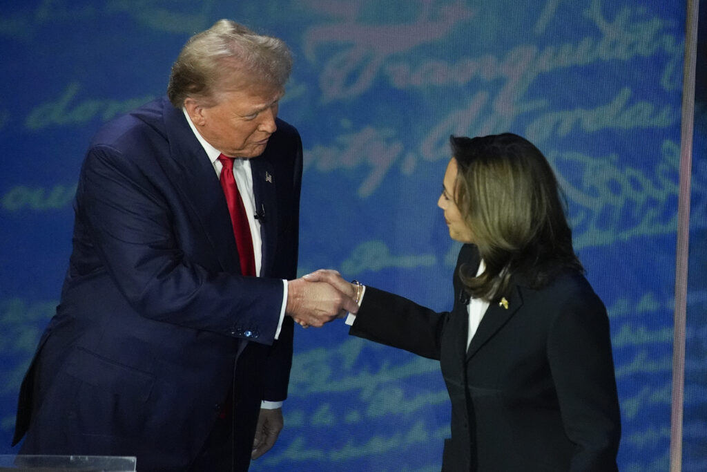 Presidential contenders Donald Trump and Kamala Harris shake hands at 2024 presidential debate