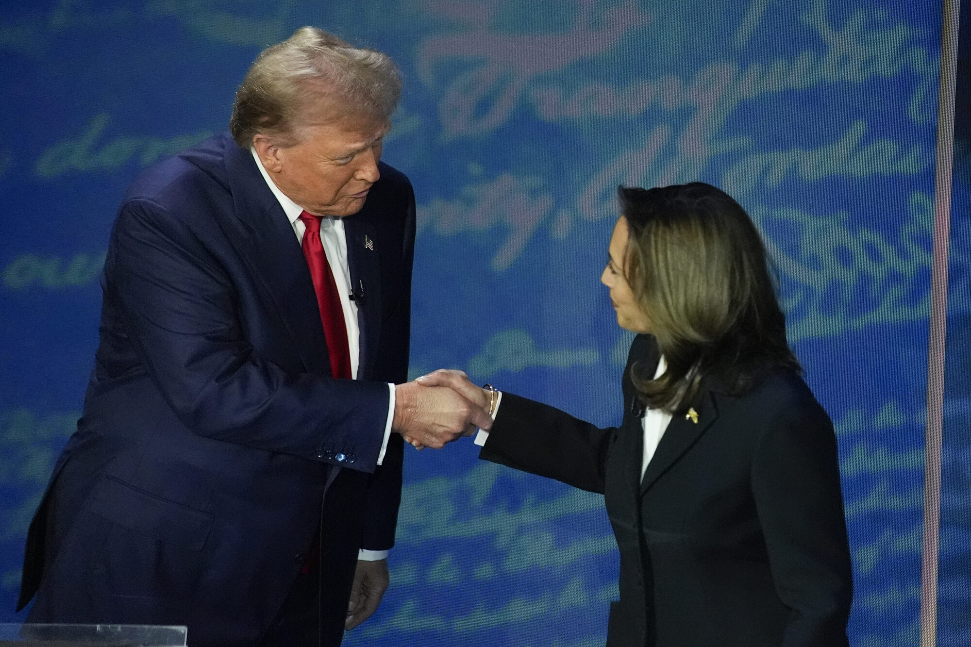 Presidential contenders Donald Trump and Kamala Harris shake hands at 2024 presidential debate